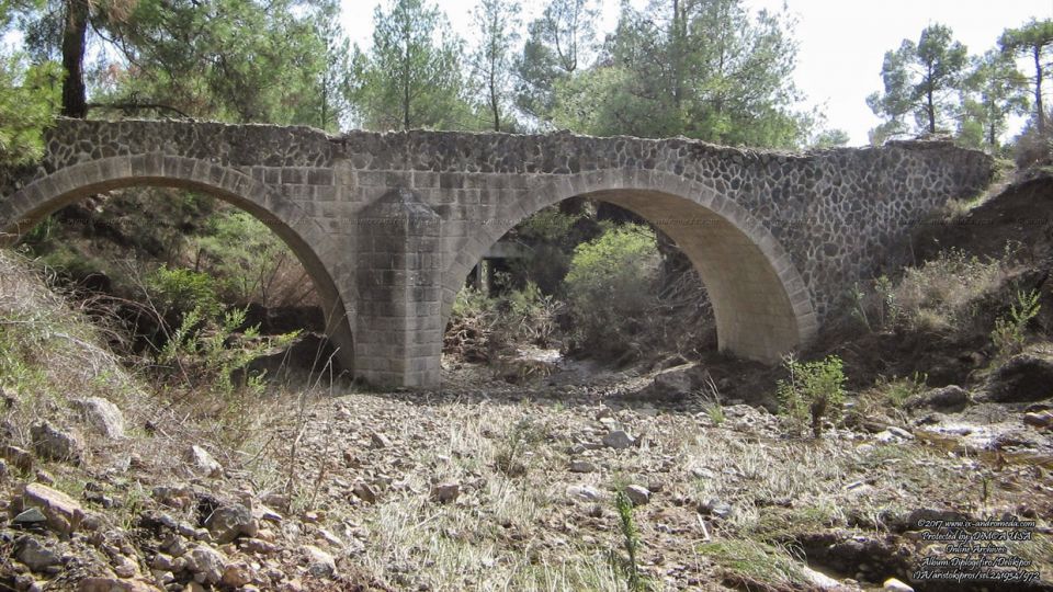 The old, beautiful Diplogefiro (double bridge) at the Milos river